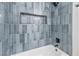 Stylish bathtub with modern blue tile surround and built-in niche at 3790 Shirebrook Dr # 167, Las Vegas, NV 89115