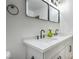 Bathroom with a double sink vanity, modern fixtures, and a clean, minimalist design with a dual mirror at 3790 Shirebrook Dr # 167, Las Vegas, NV 89115