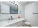 Bathroom featuring single sink vanity, modern fixtures, and a clean, minimalist design with a large mirror at 3790 Shirebrook Dr # 167, Las Vegas, NV 89115
