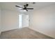 Clean bedroom featuring carpet and a ceiling fan with a view to another room at 3790 Shirebrook Dr # 167, Las Vegas, NV 89115