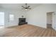 Well-lit living room with a fireplace, new floors, and neutral paint at 3790 Shirebrook Dr # 167, Las Vegas, NV 89115