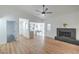 Bright living room featuring modern ceiling fan, fireplace, and open floor plan at 3790 Shirebrook Dr # 167, Las Vegas, NV 89115