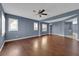 Spacious living room with hardwood floors, ceiling fan, and plantation shutters at 4063 Lower Saxon Ave, North Las Vegas, NV 89085