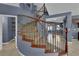 Carpeted staircase with ornamental iron spindles and wood handrail at 4063 Lower Saxon Ave, North Las Vegas, NV 89085