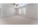 Large bedroom with ceiling fan and natural light at 4740 Killington St, Las Vegas, NV 89129