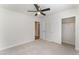 Bedroom with neutral carpet, fan, and a closet ready for personalization at 4740 Killington St, Las Vegas, NV 89129
