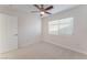 Bedroom with neutral carpet, ceiling fan, and natural light from the window at 4740 Killington St, Las Vegas, NV 89129