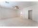 Spacious bedroom featuring neutral carpet, ceiling fan, and closet at 4740 Killington St, Las Vegas, NV 89129