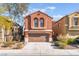 Attractive two-story home with a two-car garage and desert-friendly landscaping at 4740 Killington St, Las Vegas, NV 89129