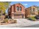 Inviting two-story home with a two-car garage and well-maintained landscaping at 4740 Killington St, Las Vegas, NV 89129
