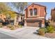 Charming two-story home featuring a two-car garage and desert landscaping at 4740 Killington St, Las Vegas, NV 89129