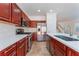 Modern kitchen featuring stainless steel appliances, white countertops, and tile flooring at 4740 Killington St, Las Vegas, NV 89129