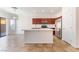 Well-equipped kitchen featuring a center island, stainless steel appliances, and tile flooring at 4740 Killington St, Las Vegas, NV 89129