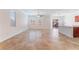 Bright open-concept living area with tile flooring, large windows, and kitchen at 4740 Killington St, Las Vegas, NV 89129