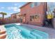 Backyard pool with shimmering water, surrounded by a desert landscape at 4740 Killington St, Las Vegas, NV 89129