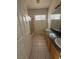 Bathroom with a granite countertop, dual sinks, tiled floor and shower at 5214 Monterey Park Cir, Las Vegas, NV 89146