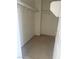 Walk-in closet with neutral carpet, white walls and metal shelving at 5214 Monterey Park Cir, Las Vegas, NV 89146