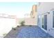 The home has a low maintenance backyard with paver patio, rock landscaping, and block wall at 5269 Acadia Leaf St, Las Vegas, NV 89166