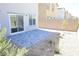 Well-maintained backyard with pavers, a decorative rock bed, and a block wall fence at 5269 Acadia Leaf St, Las Vegas, NV 89166