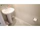 A clean bathroom featuring pedestal sink, modern fixtures, and neutral-colored walls at 5269 Acadia Leaf St, Las Vegas, NV 89166