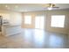 Open-concept living area with tile flooring, white trim, and large sliding glass door at 5269 Acadia Leaf St, Las Vegas, NV 89166