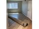 Neutral bedroom with tiled flooring and a window offering natural light at 579 Roxella Ln # D, Las Vegas, NV 89110