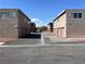 View of two apartment buildings with garages, showcasing a tidy complex layout and ample parking at 579 Roxella Ln # D, Las Vegas, NV 89110