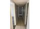 Hallway with tile flooring connecting different areas of the home, including a glimpse of carpeted room at 579 Roxella Ln # D, Las Vegas, NV 89110