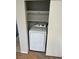 Convenient laundry area with a modern white dryer and built-in shelving at 579 Roxella Ln # D, Las Vegas, NV 89110