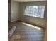 Bright living room featuring tiled floors and a large window providing ample natural light at 579 Roxella Ln # D, Las Vegas, NV 89110
