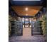 Welcoming entryway featuring a modern metal gate, a covered walkway, and a stylish glass front door at 58 Midnight Sky Dr, Las Vegas, NV 89135