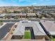Stunning aerial view of a modern home with a charming courtyard and desert landscaping in a vibrant neighborhood at 6801 Steel Mist St, Las Vegas, NV 89148