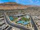 Aerial view of the community clubhouse, pool, and tennis courts showcasing the neighborhood amenities at 6801 Steel Mist St, Las Vegas, NV 89148