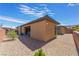 Spacious backyard features desert landscape, hardscape patio with barbecue and outdoor seating at 6801 Steel Mist St, Las Vegas, NV 89148