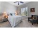 Cozy bedroom with neutral walls and a large window at 6801 Steel Mist St, Las Vegas, NV 89148