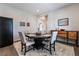 Elegant dining room featuring a round table and hardwood floors at 6801 Steel Mist St, Las Vegas, NV 89148