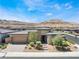 Charming single-story home featuring desert landscaping and a brick driveway at 6801 Steel Mist St, Las Vegas, NV 89148