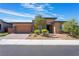 Inviting single-story house with desert landscaping and a two-car garage at 6801 Steel Mist St, Las Vegas, NV 89148