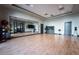 Spacious workout room with wood flooring, a mirrored wall, and a selection of gym balls and equipment at 6801 Steel Mist St, Las Vegas, NV 89148