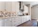 Bright modern kitchen with stainless steel appliances, white cabinets, and granite counters at 6801 Steel Mist St, Las Vegas, NV 89148