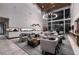 Spacious lounge area with comfortable seating, modern decor, and large windows at 6801 Steel Mist St, Las Vegas, NV 89148