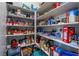 Organized walk-in pantry features ample shelving stocked with a variety of food items and household goods at 6801 Steel Mist St, Las Vegas, NV 89148