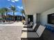 Comfortable poolside lounge chairs offer a relaxing retreat near a stunning pool and lush landscaping at 6801 Steel Mist St, Las Vegas, NV 89148