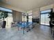 Bright recreation room featuring a ping pong table, modern decor, and cozy seating at 6801 Steel Mist St, Las Vegas, NV 89148