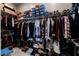 Spacious walk-in closet providing ample storage with multiple shelves and racks for clothes, shoes, and accessories at 6801 Steel Mist St, Las Vegas, NV 89148