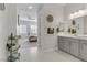Bathroom with double vanity, towel rack, and view of bedroom at 8729 Marcana St, Las Vegas, NV 89166