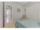 Bright bedroom featuring neutral colors and a soft blue accent color at 8729 Marcana St, Las Vegas, NV 89166