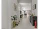Bright hallway with tile flooring leads to the dining and living areas at 8729 Marcana St, Las Vegas, NV 89166