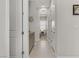Neutral hallway with a built-in cabinet, leading to additional rooms within the home at 8729 Marcana St, Las Vegas, NV 89166