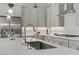 This kitchen features sleek countertops, modern appliances, ample storage, stainless steel sink and a stylish faucet at 8729 Marcana St, Las Vegas, NV 89166